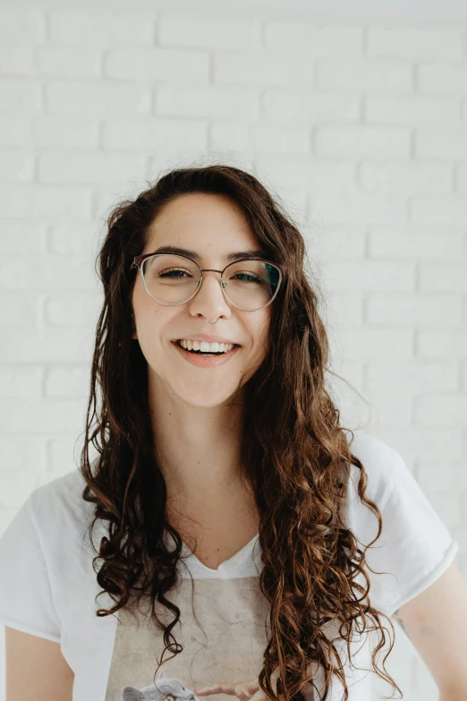 woman wearing glasses posing for a po