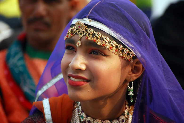 close up of a child wearing traditional garba