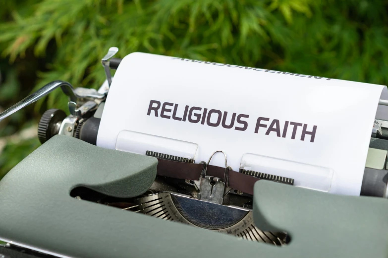 a text on the white paper is reading religious faith