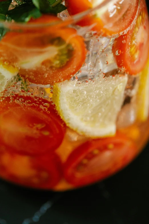 a bowl filled with slices of red, yellow and green food