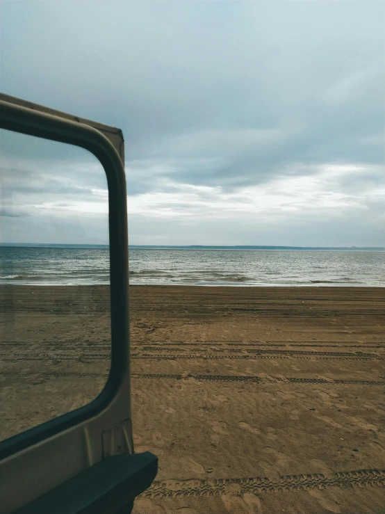 a bus is at the edge of the beach