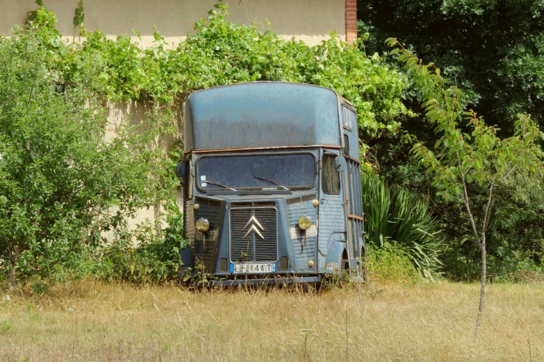 the truck is standing still in a field