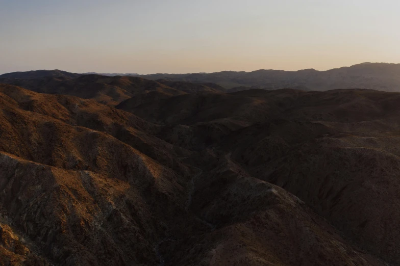 an aerial s of a mountain range with sunset