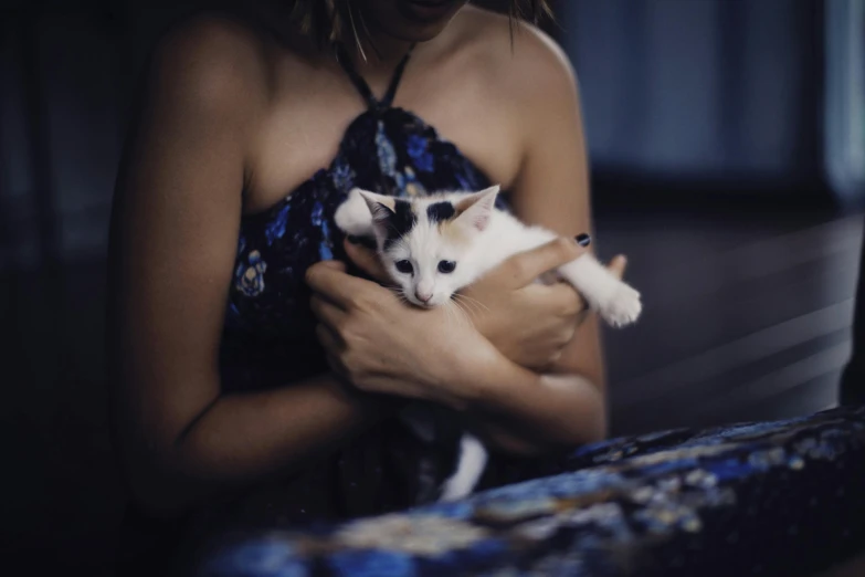an image of a girl holding a cat