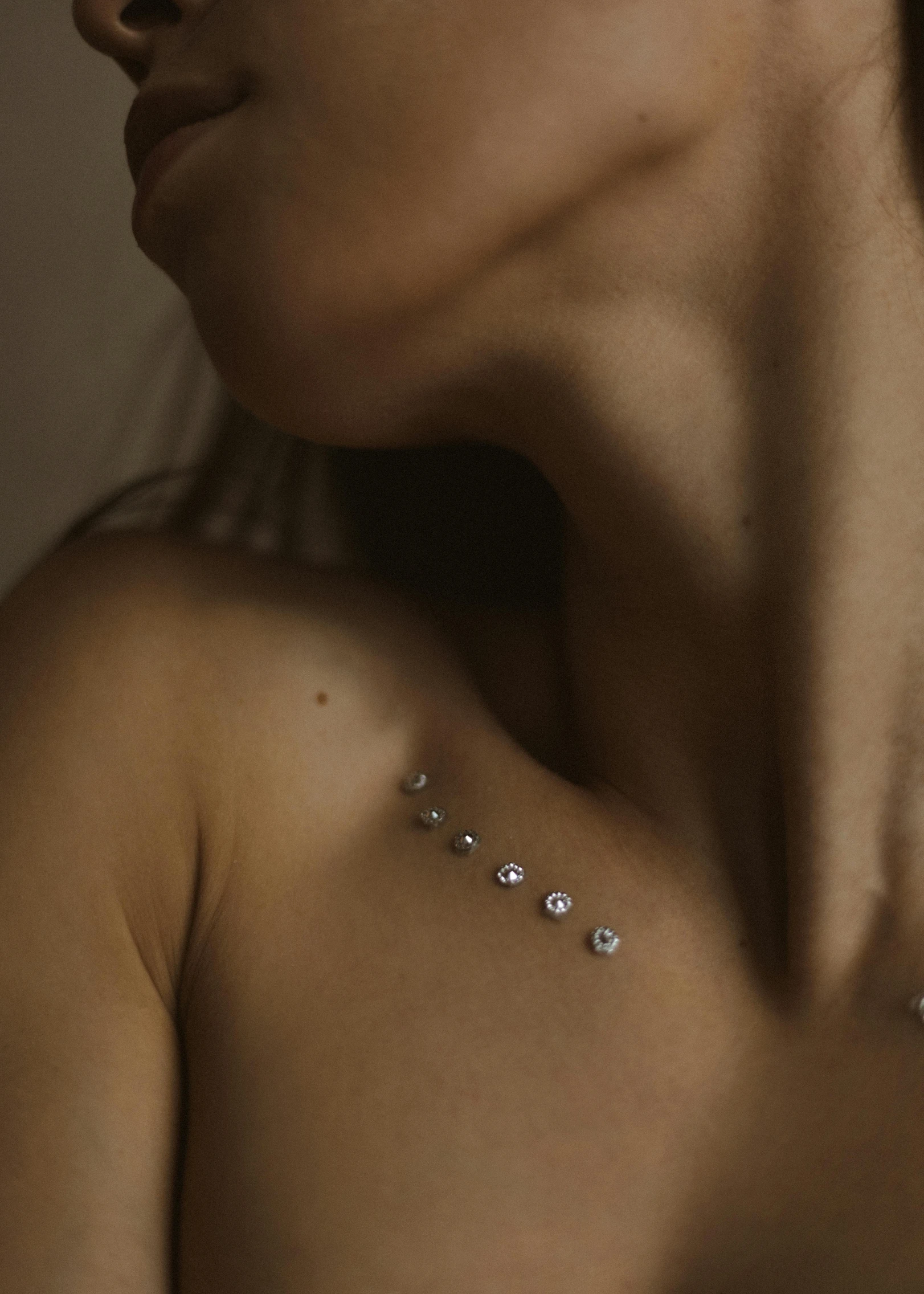 a woman's back covered in pearls