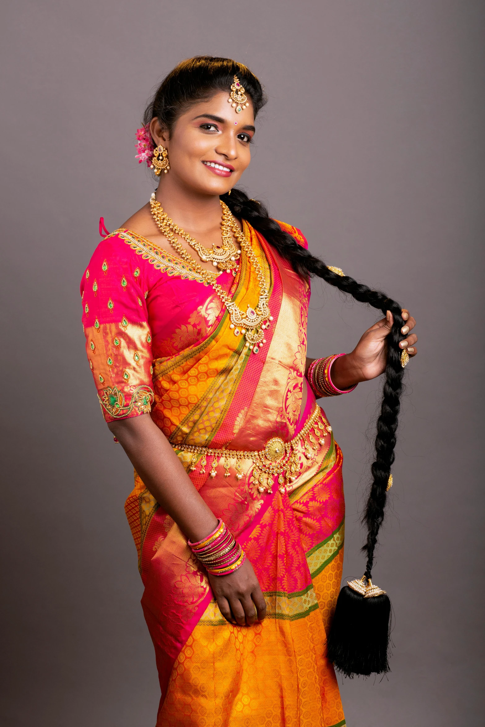 an indian woman in a colorful sari and jewelry