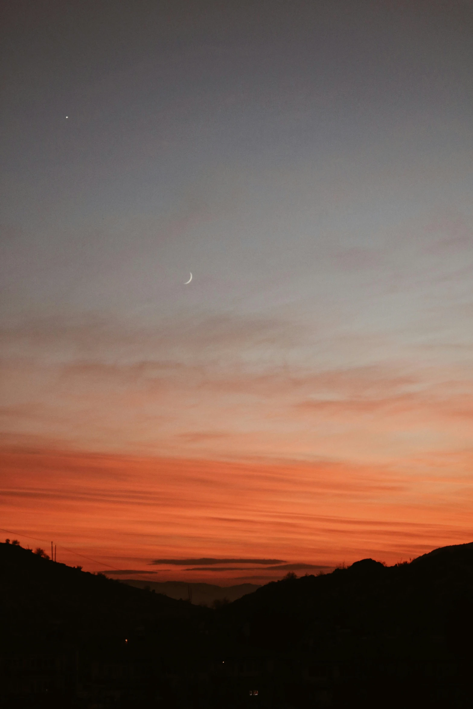 the sky is very dark, and red at night