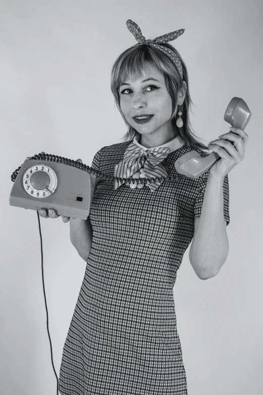 a woman with a clock holding two hair brushes