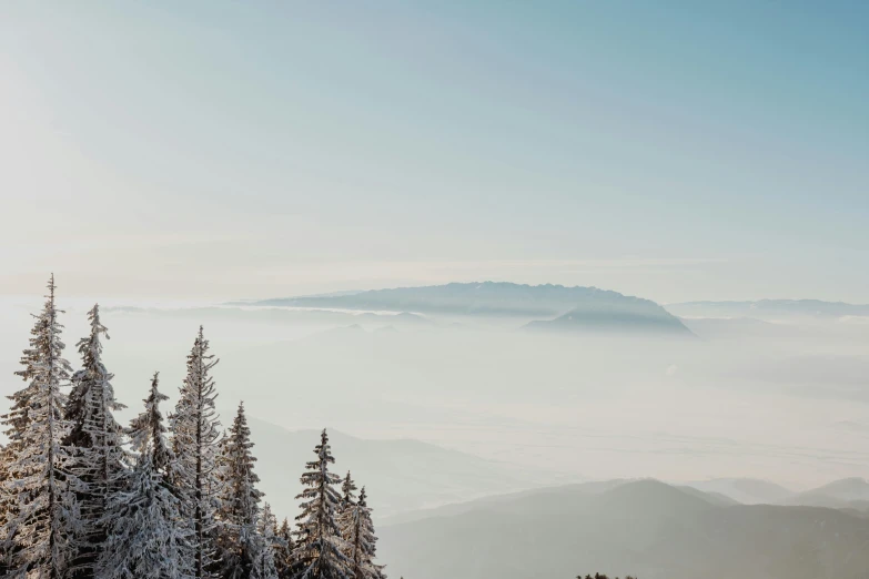 the mountains and snow have just been blanketed with some fog