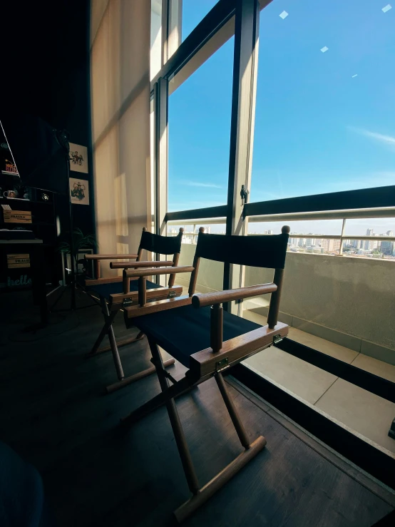 empty seats sitting in a waiting room overlooking the city