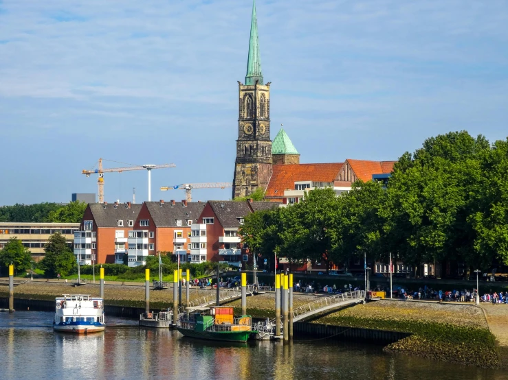 the river has boats on it near the large tower