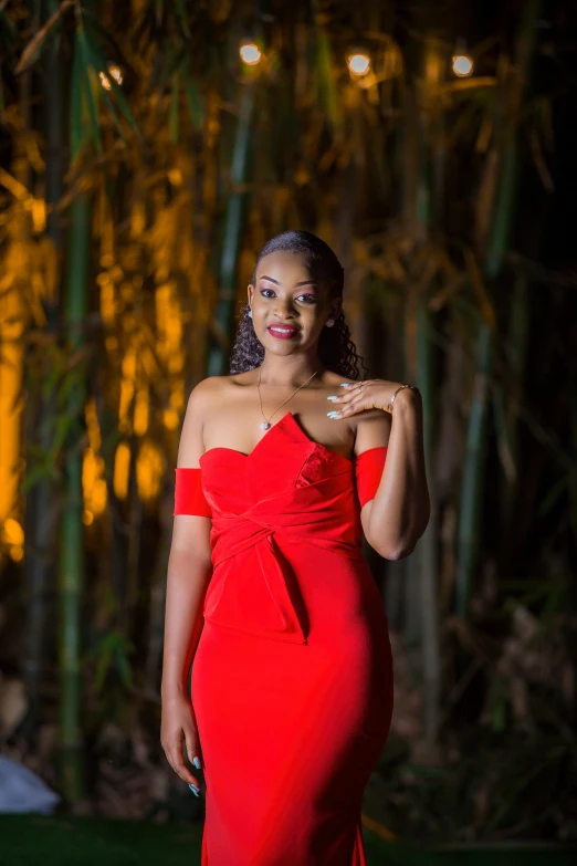 a woman in red wearing a red evening dress