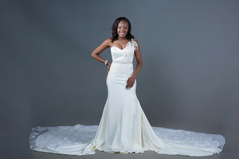 a woman standing on top of a white gown