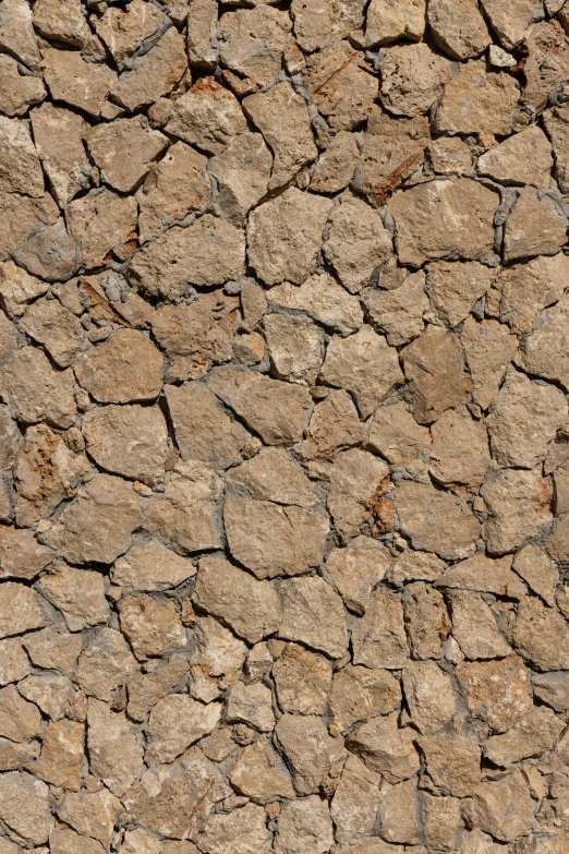 a dried up field with rocks and small pieces of dirt on it