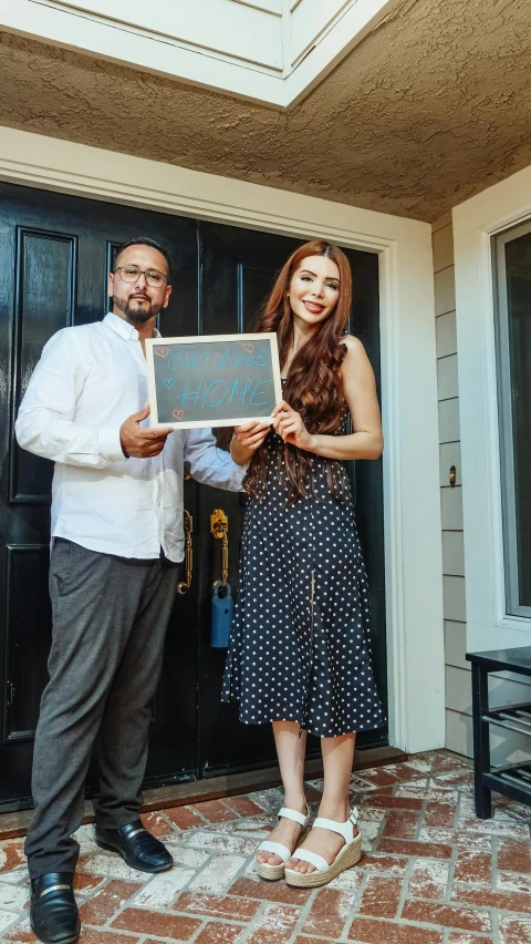 two people that are holding an item