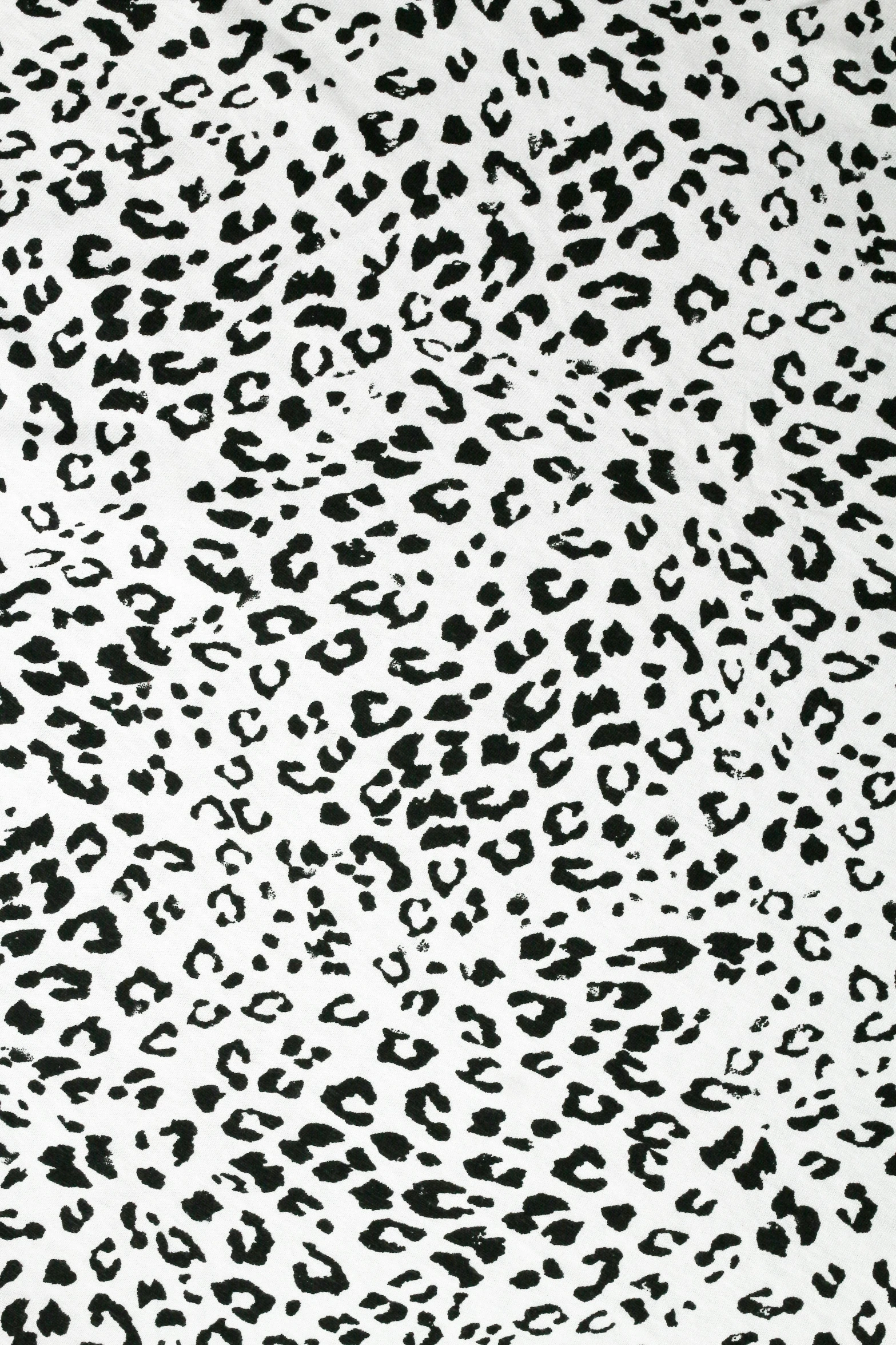 a black and white image of spots