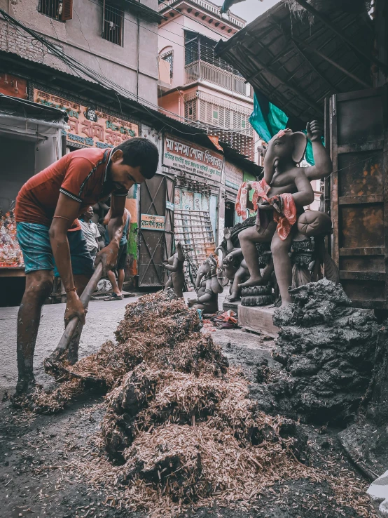 a person with a shovel digging in the dirt