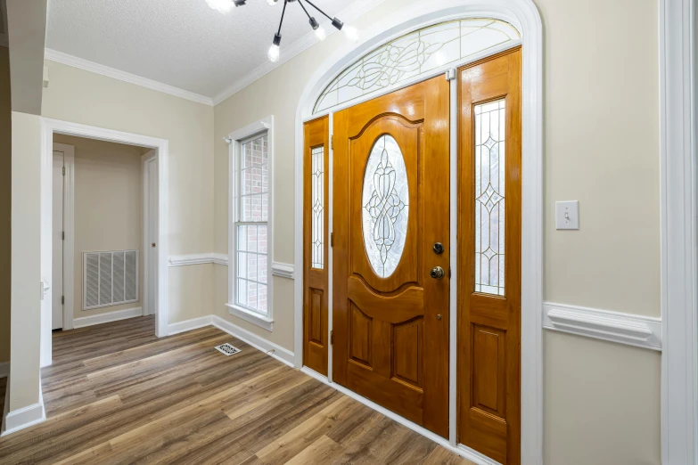 a doorway with a door and a light fixture