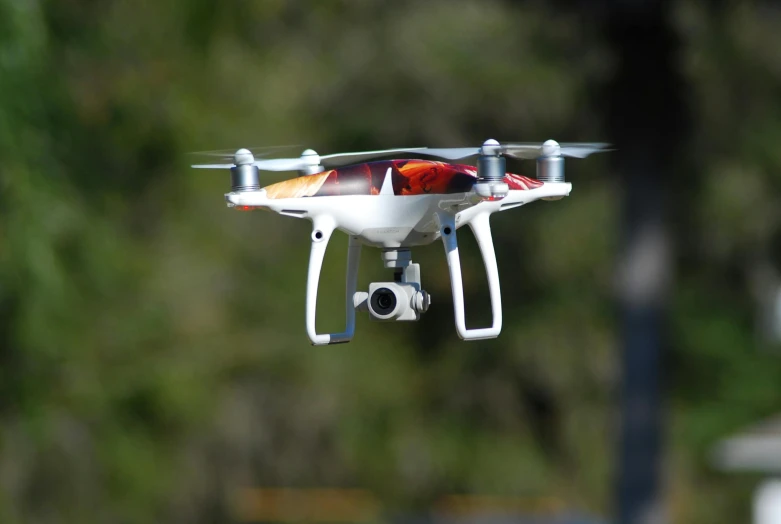 the underside view of a small white and red model with the lights on