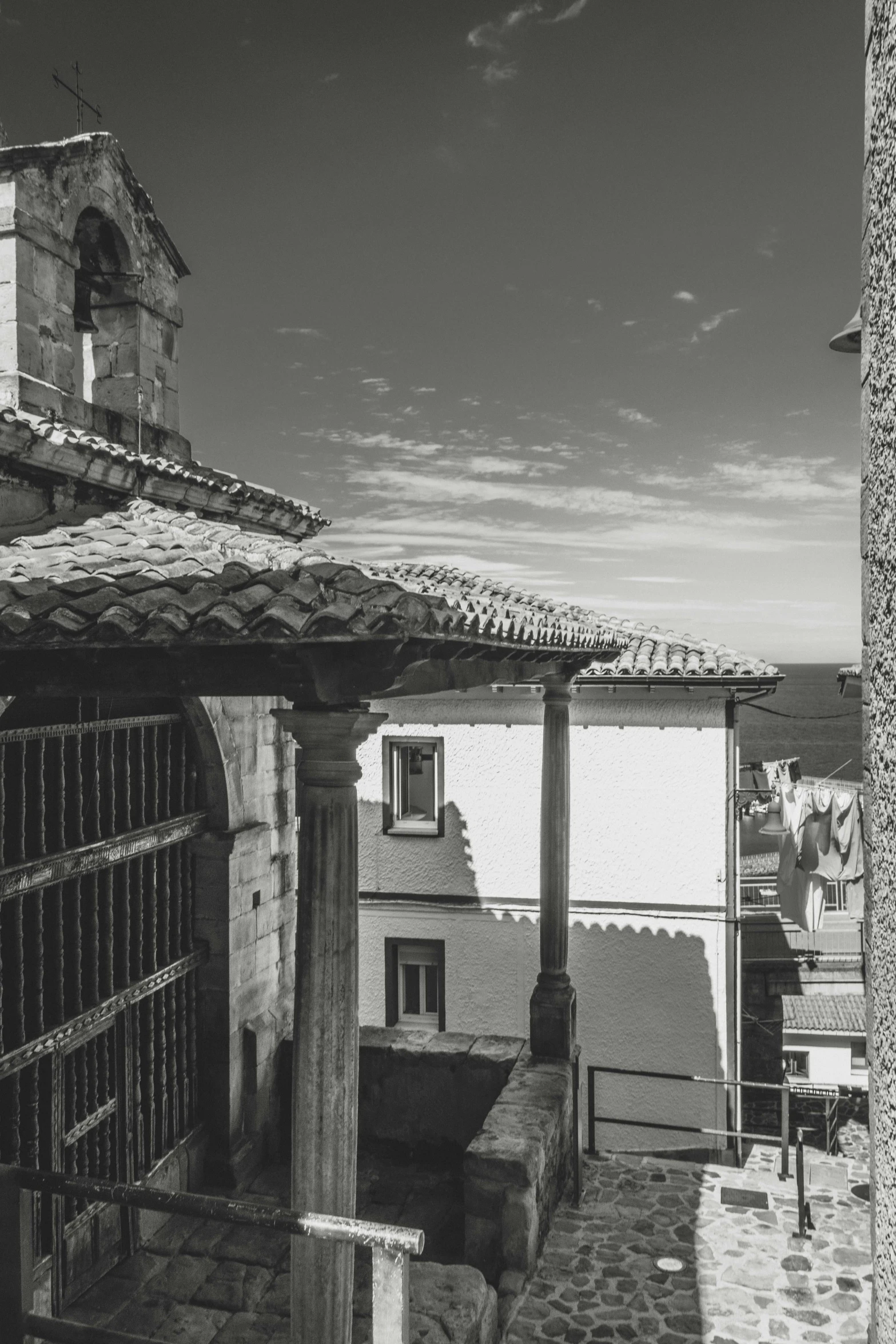 a black and white po of a building with a balcony