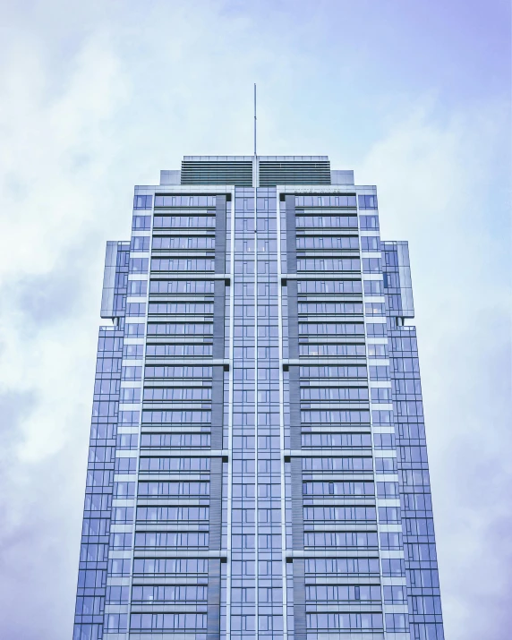a tall building has several balconies and windows
