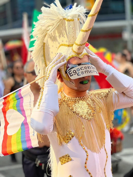 there is a parade that has people wearing a mask