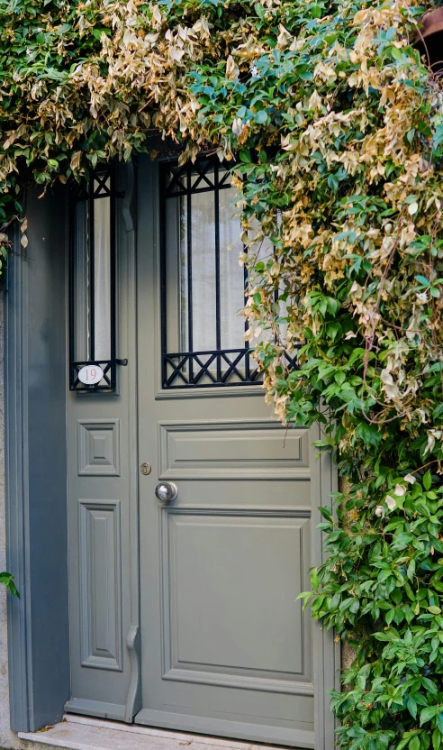 an old house with a beautiful door and wall in the center