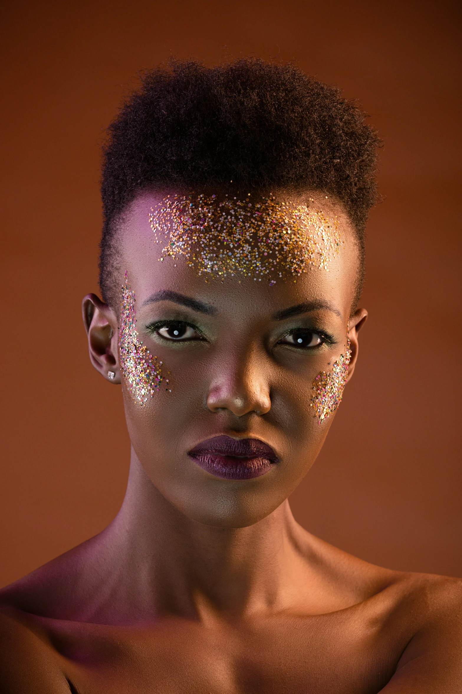 an african american woman with gold holographic on her face