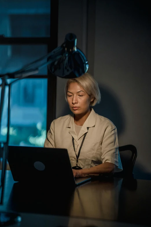 a person that is sitting in front of a laptop