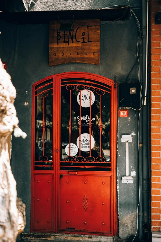 a red door leading into a brick building