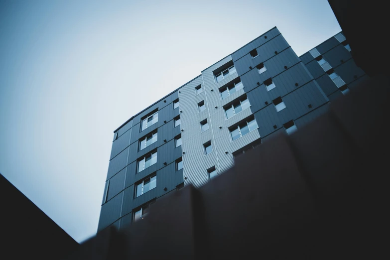 the view from below looking at a large building