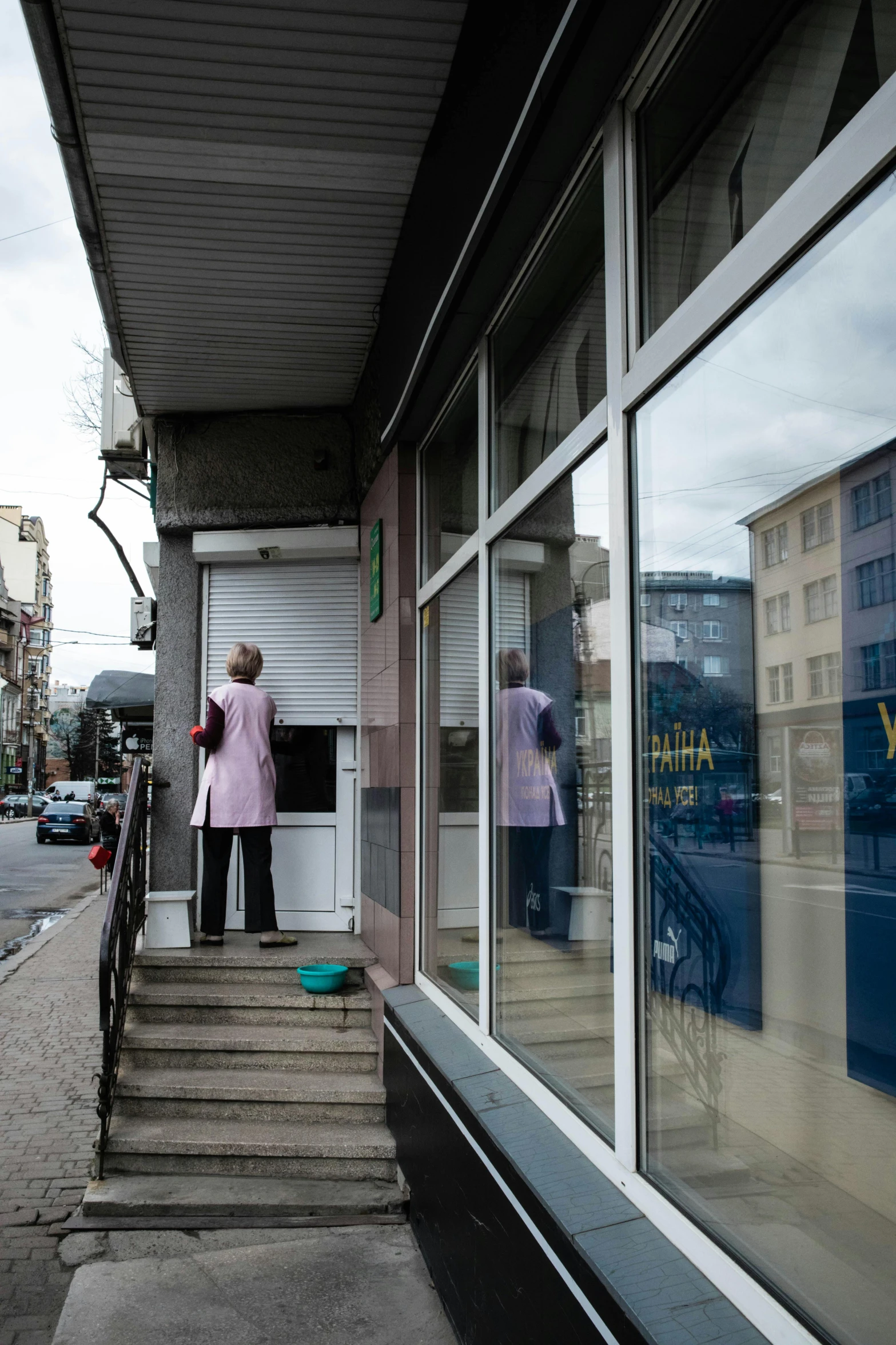 two people are standing outside of a closed shop