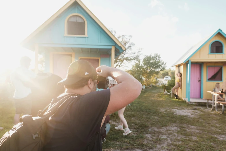 a man looking at his house while on the phone