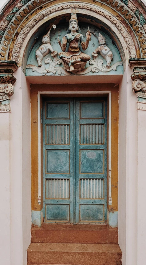 two doorways with wooden steps leading up to them