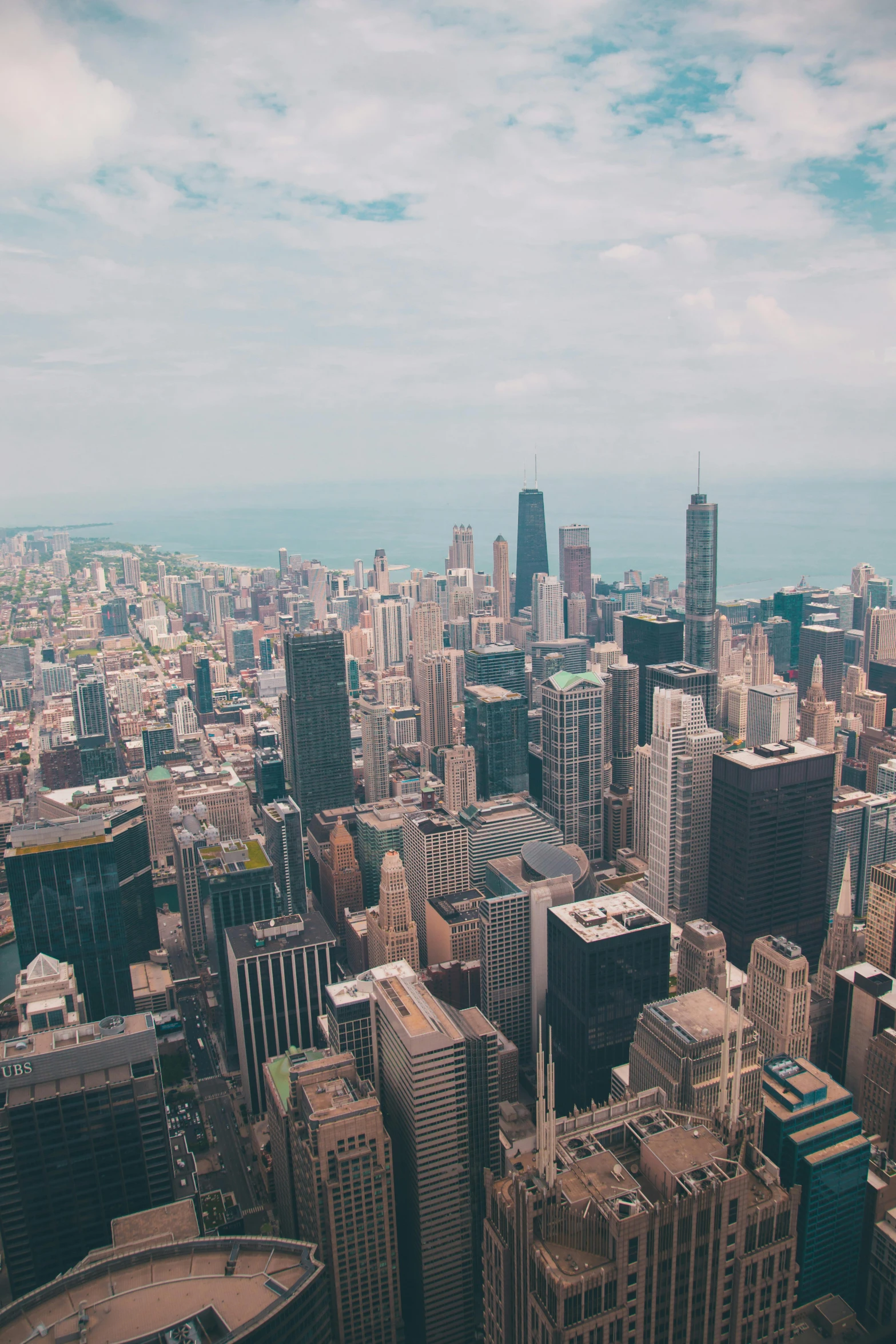 looking down at tall buildings in a city