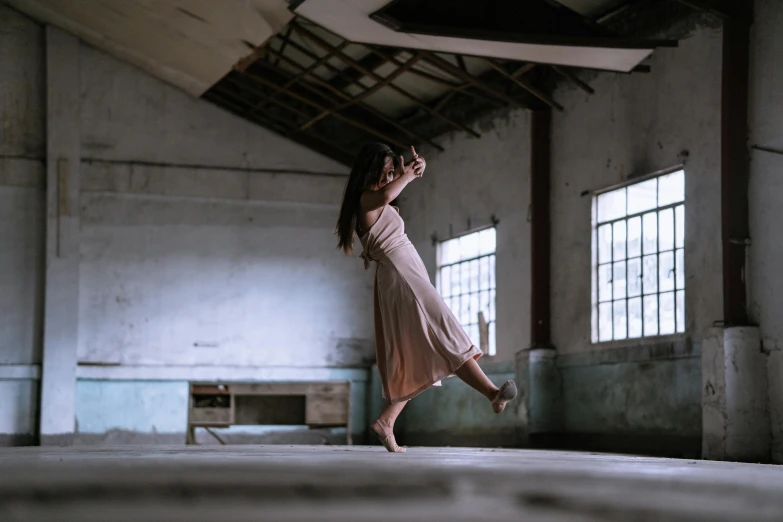 a woman is doing a split on the ground