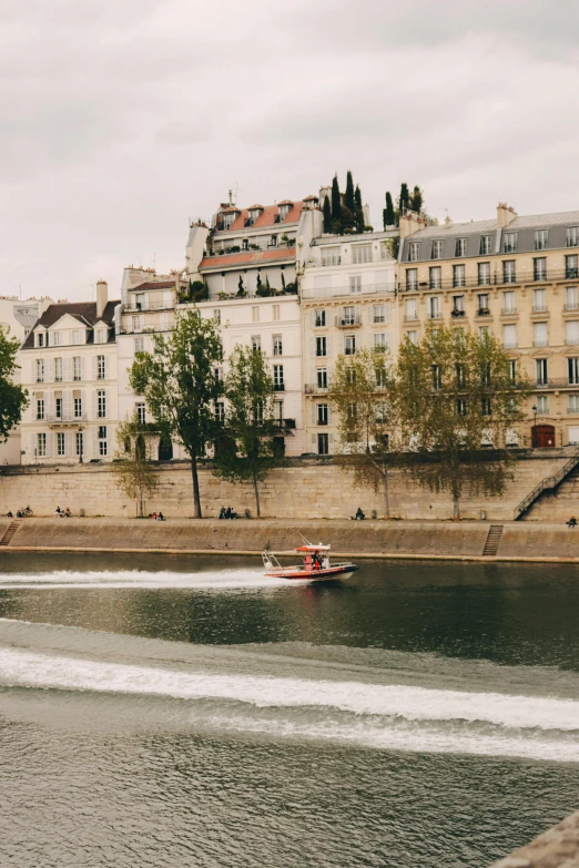 the speedboat sails down the canal in paris