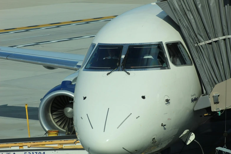 the airplane is docked at the airport terminal