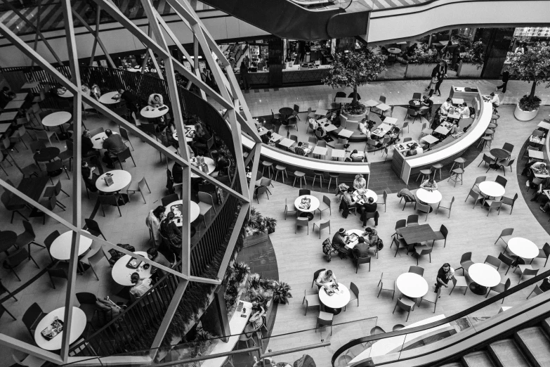 a black and white picture of a food court