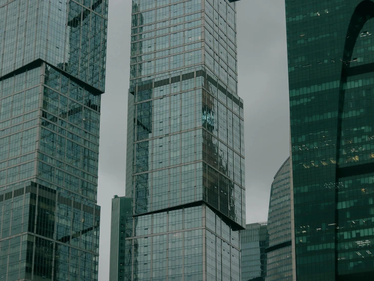 the view of some very tall buildings in a city