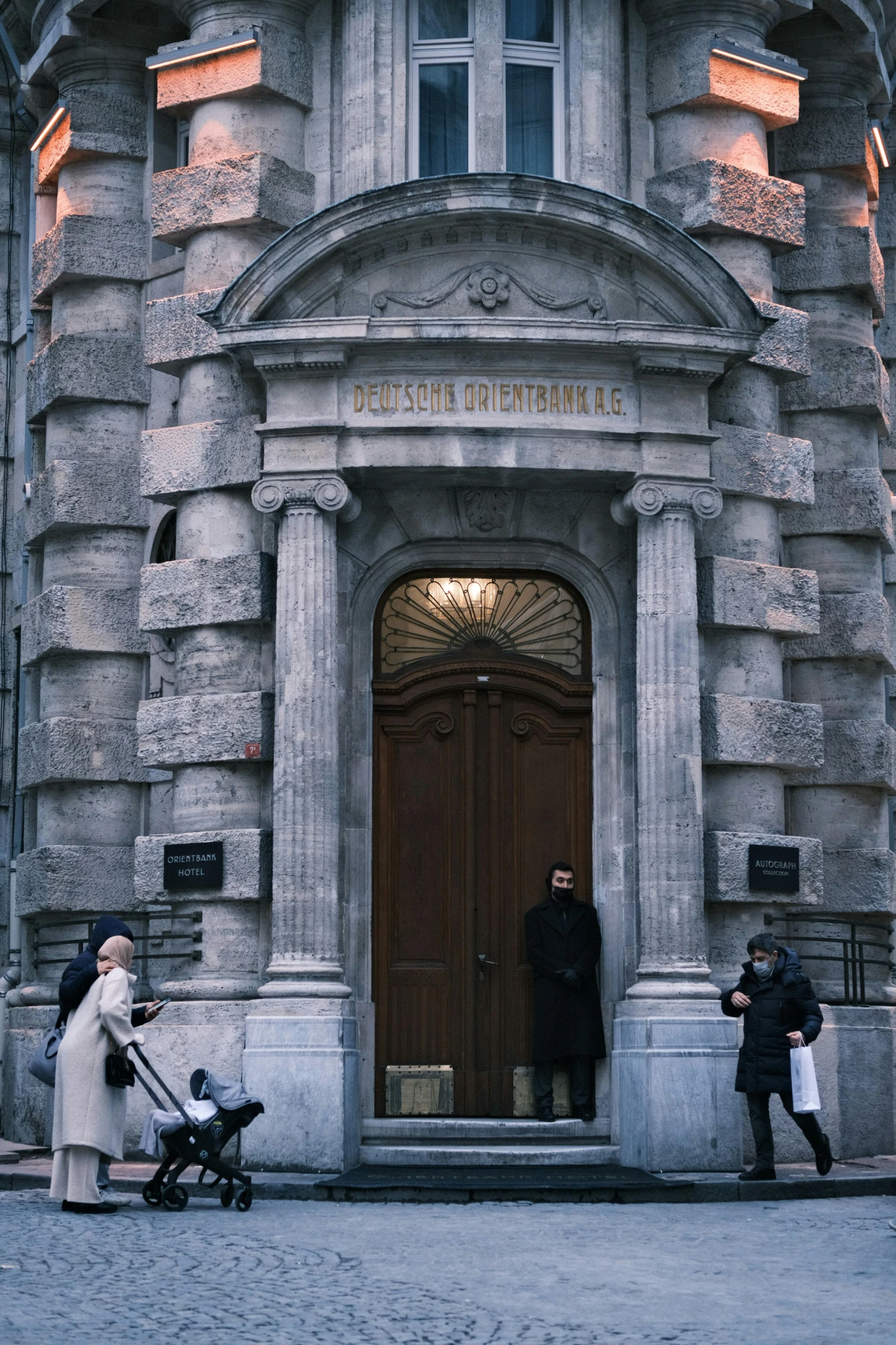 an older building with two people standing outside