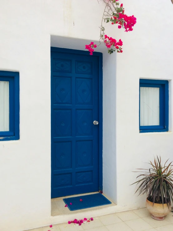 a front door in a white and blue color