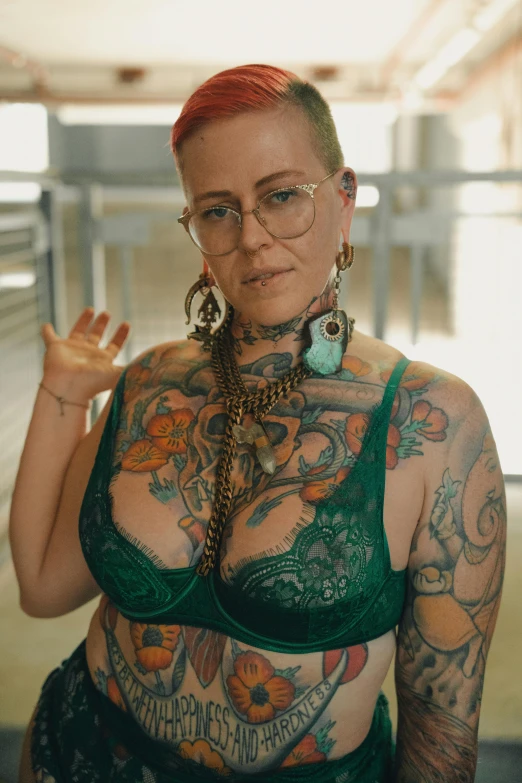tattooed woman standing in a store in the middle of her underwear