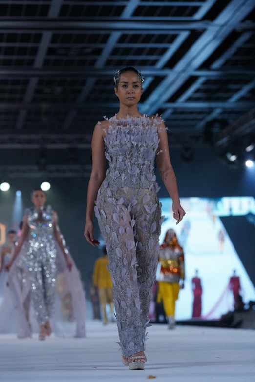 fashion show during a show wearing beaded outfits