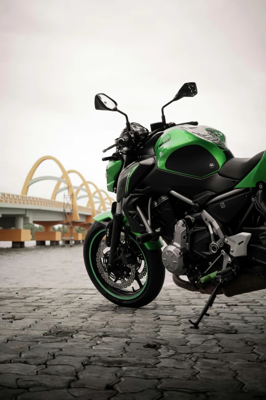 the motorcycle is green and black in color