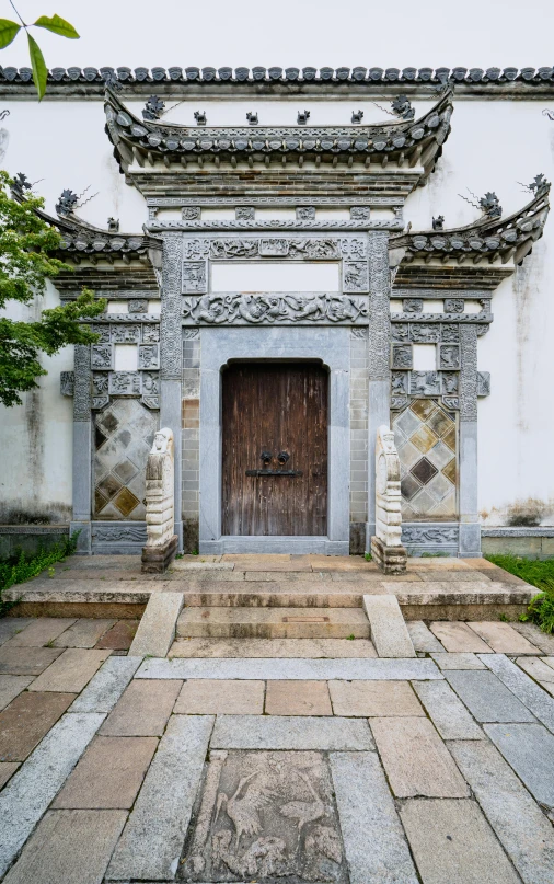 the front of a very old building with a wooden door