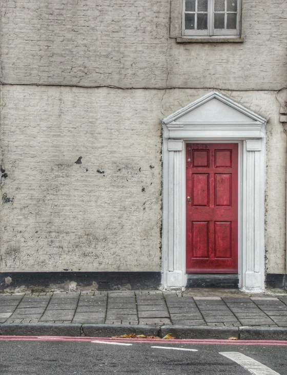 there is a red door and a white arch