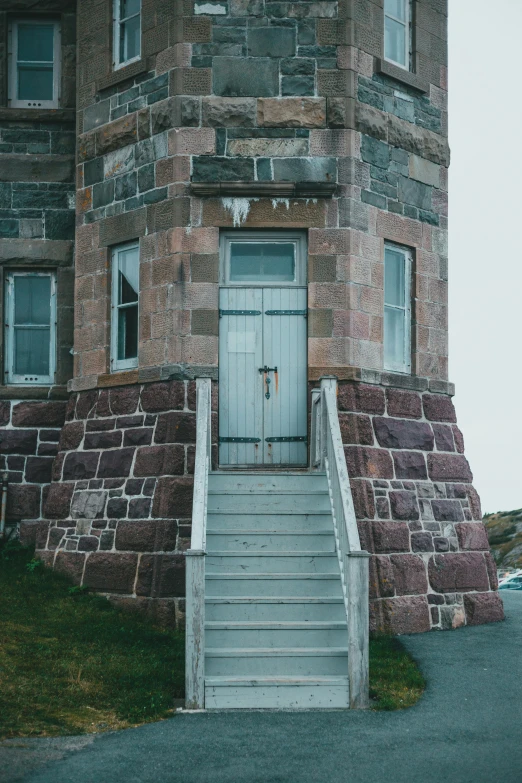 this is an old building with steps leading to it