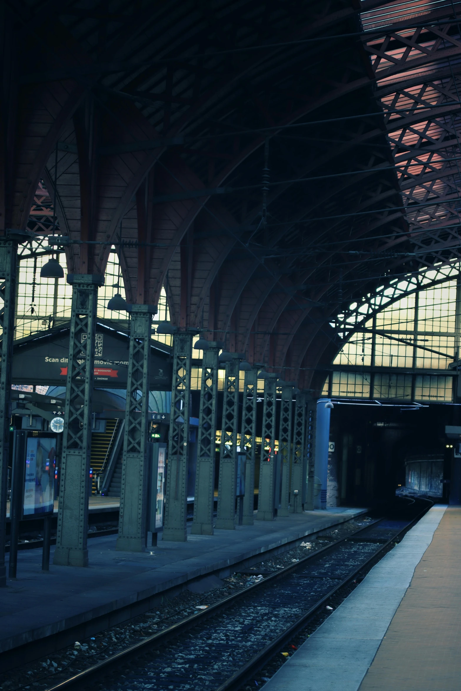 a view of a train station from the platform