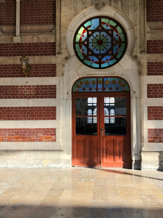 two doors with stained glass on the top and bottom